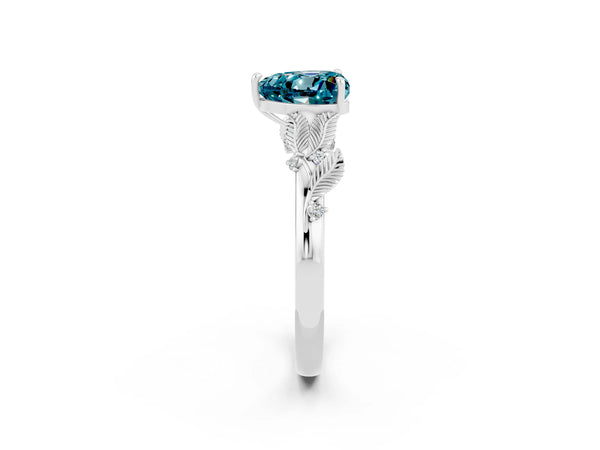Silver Heart Cut Blue Topaz Solitaire Ring with Leaf Motif Band and Four-Prong Setting