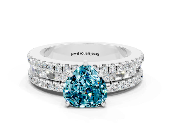 White gold Heart Cut Blue Topaz Solitaire Ring with Pavé and Channel Set Band