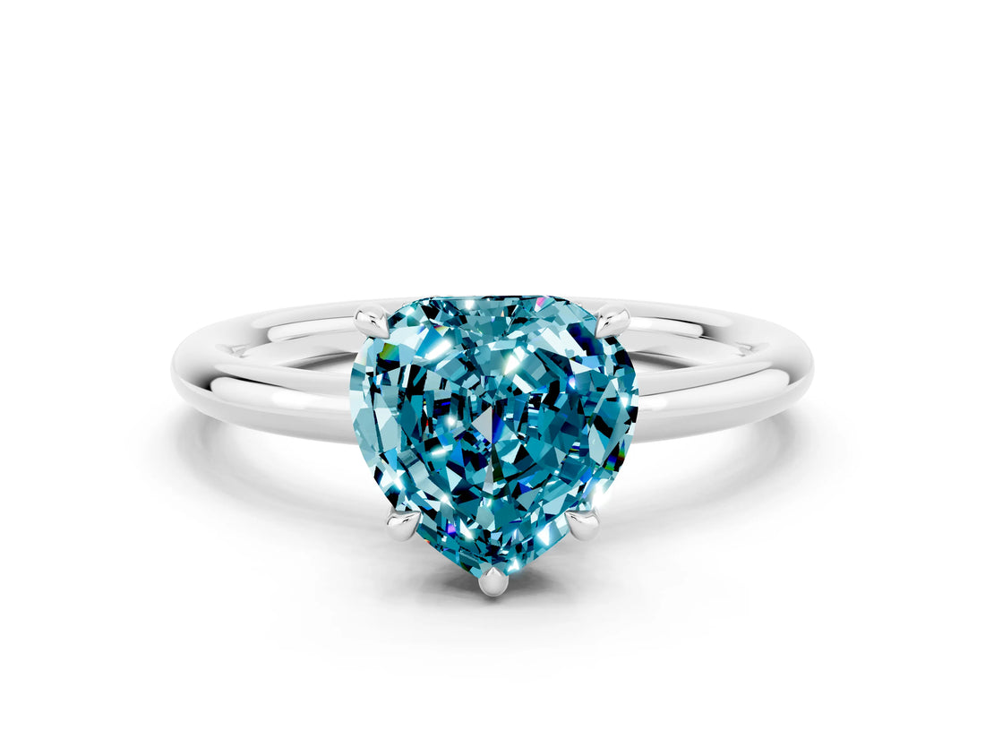 White gold Heart Cut Blue Topaz Solitaire Ring with Thin Band and Four-Prong Setting
