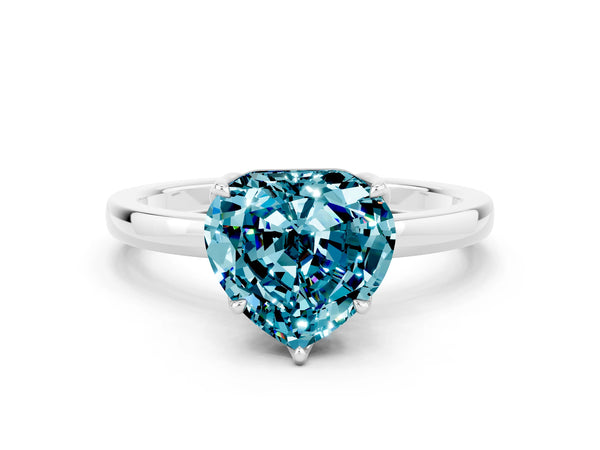 Platinum Heart Cut Blue Topaz Solitaire Ring with Thin Band and Prong Setting
