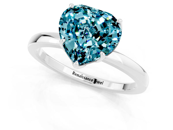 Silver Heart Cut Blue Topaz Solitaire Ring with Thin Band and Prong Setting