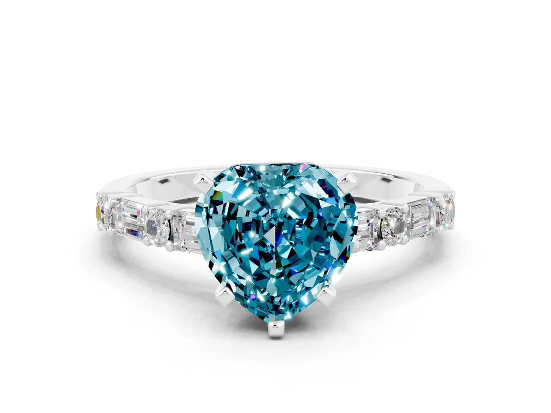 White gold Heart Cut Blue Topaz Solitaire with Side Baguettes and Channel Set Band