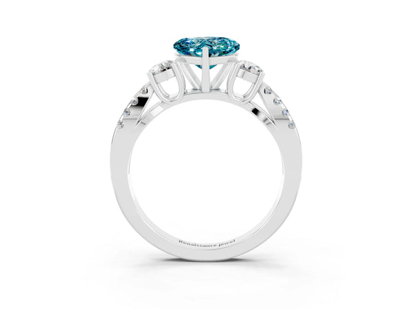 Platinum Heart Cut Blue Topaz Three-Stone Ring with Pavé Split Shank and Four-Prong Setting
