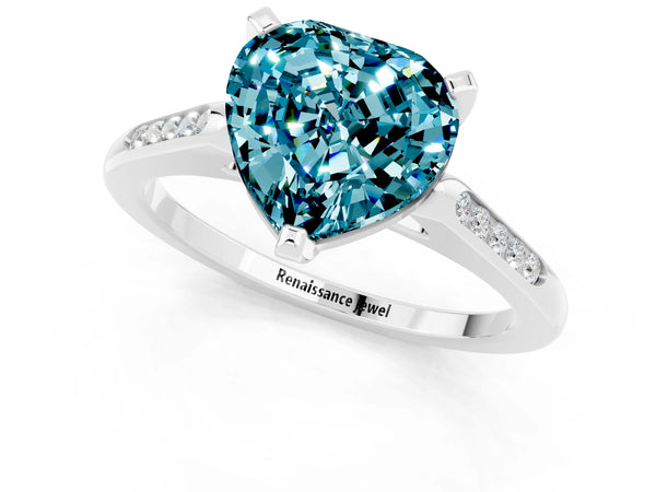 Silver Heart Cut Blue Topaz Solitaire Ring with Channel Set Round Band and Prong Setting