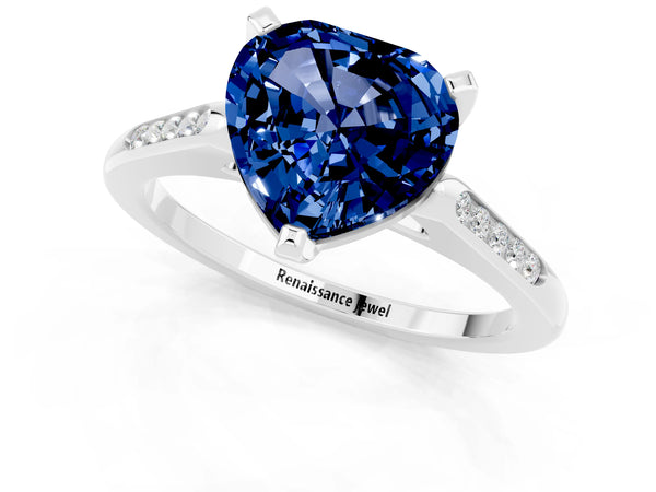 Silver Heart Cut Blue Sapphire Solitaire Ring with Channel Set Round Band and Prong Setting