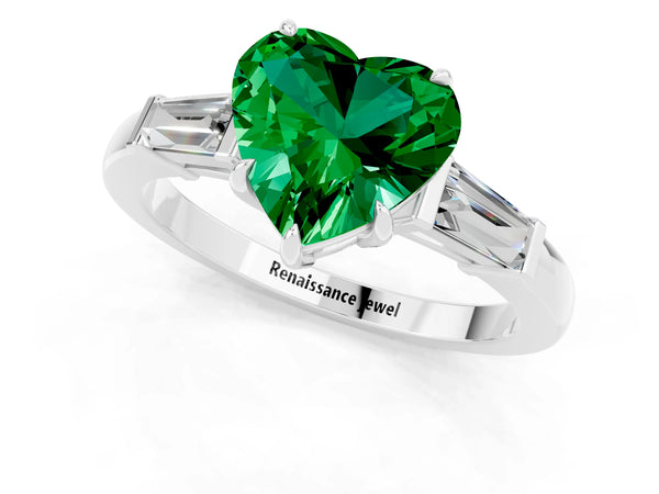White gold Heart Cut Emerald Three-Stone Ring with Tapered Baguette Side Stones and Prong Setting