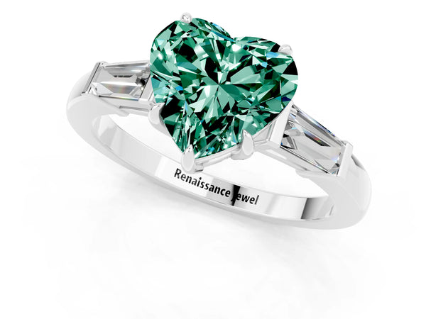Platinum Heart Cut Green Sapphire Three-Stone Ring with Tapered Baguette Side Stones and Prong Setting