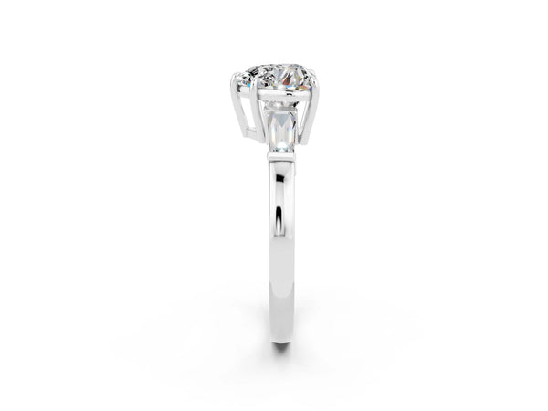 Platinum Heart Cut Moissanite Three-Stone Ring with Tapered Baguette Side Stones and Prong Setting