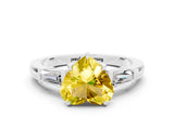 White gold Heart Cut Cut Diamond Ring with Tapered Baguette Side Stones in Four-Prong Setting