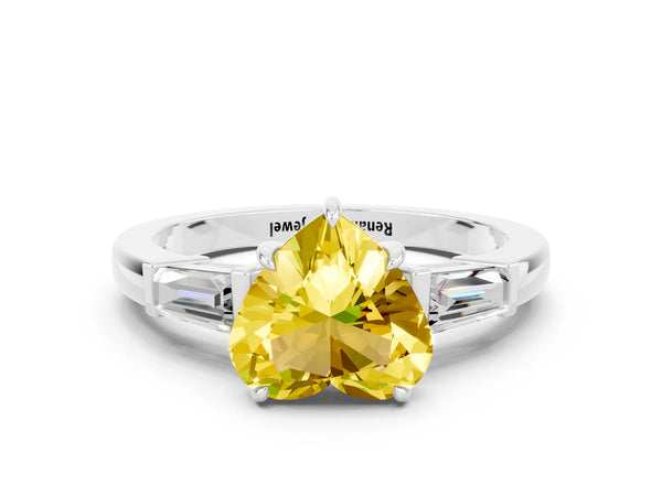 Silver Heart Cut Yellow Sapphire Three-Stone Ring with Tapered Baguette Side Stones and Prong Setting