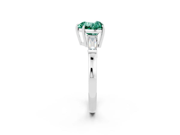 Platinum Heart Cut Green Sapphire Three-Stone Ring with Tapered Baguette Side Stones and Prong Setting