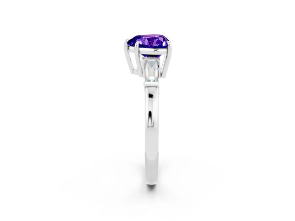 White gold Heart Cut Tanzanite Three-Stone Ring with Tapered Baguette Side Stones and Prong Setting