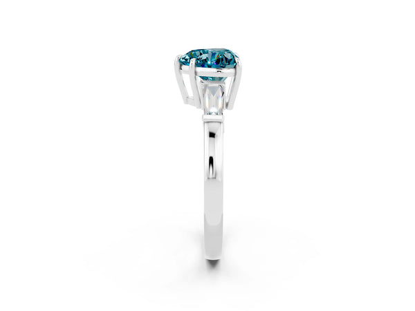 Platinum Heart Cut Cut Diamond Ring with Tapered Baguette Side Stones in Four-Prong Setting