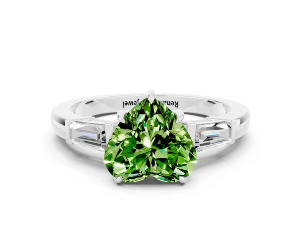 Platinum Heart Cut Cut Diamond Ring with Tapered Baguette Side Stones in Four-Prong Setting
