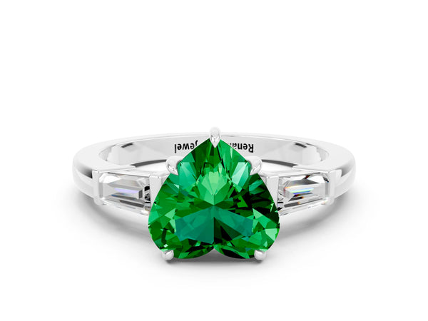 White gold Heart Cut Emerald Three-Stone Ring with Tapered Baguette Side Stones and Prong Setting