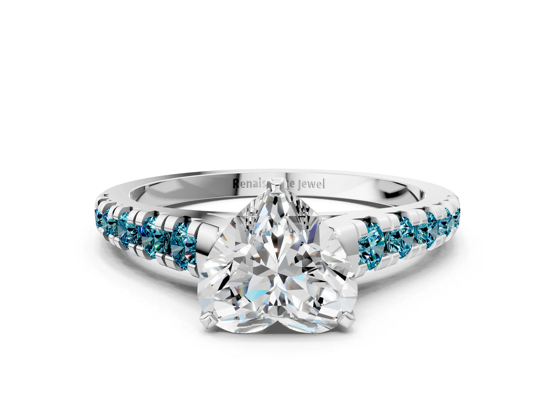 White gold Heart Cut Diamond Cathedral Solitaire Ring with Round with Blue Topaz side stone Pavé Band