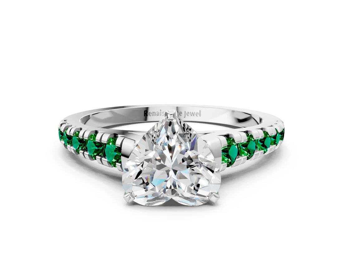 White gold Heart Cut Diamond Cathedral Solitaire Ring with Round with Emerald side stone Pavé Band
