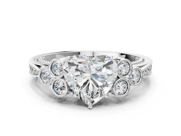 Platinum Heart Cut Diamond Engagement Ring with Bezel Set Round Side Stones and Prong Setting