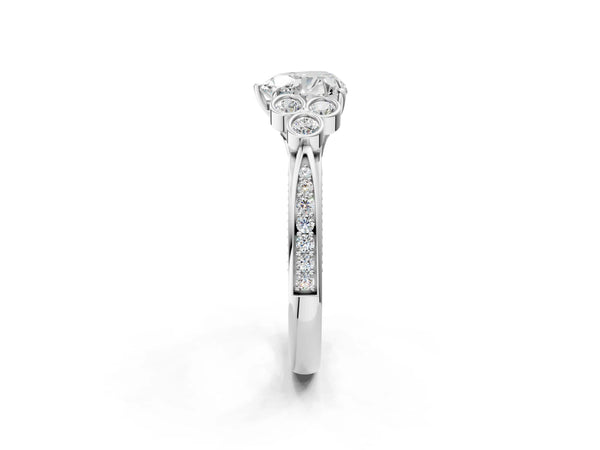 Platinum Heart Cut Diamond Engagement Ring with Bezel Set Round Side Stones and Prong Setting