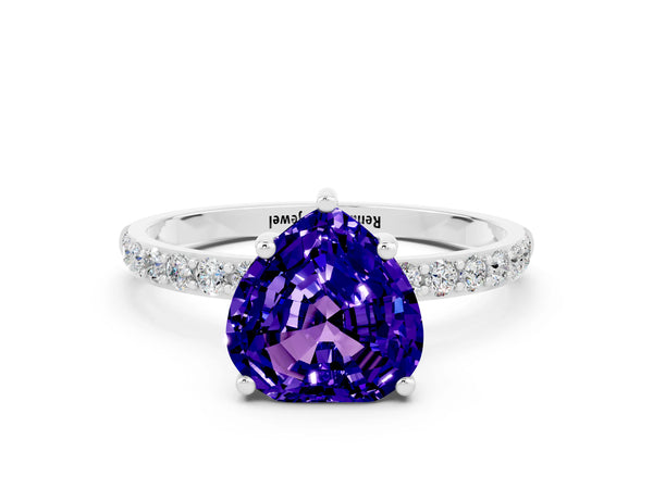 White gold Heart Cut Tanzanite Solitaire Ring with Round Pavé Shoulders and Prong Setting