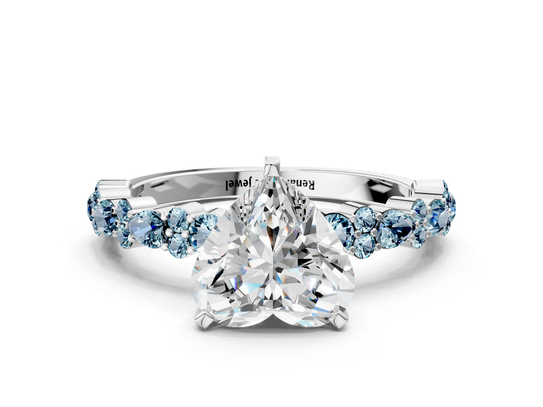 White gold Heart Cut Diamond Side Stone Solitaire Ring with Round with Aquamarine side stone and Four-Prong Setting