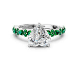 White gold Heart Cut Diamond Side Stone Solitaire Ring with Round with Emerald side stone and Four-Prong Setting