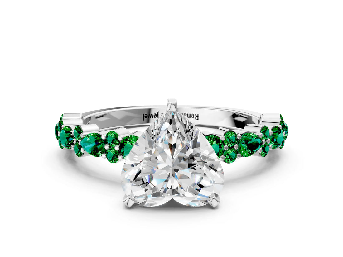 White gold Heart Cut Diamond Side Stone Solitaire Ring with Round with Emerald side stone and Four-Prong Setting