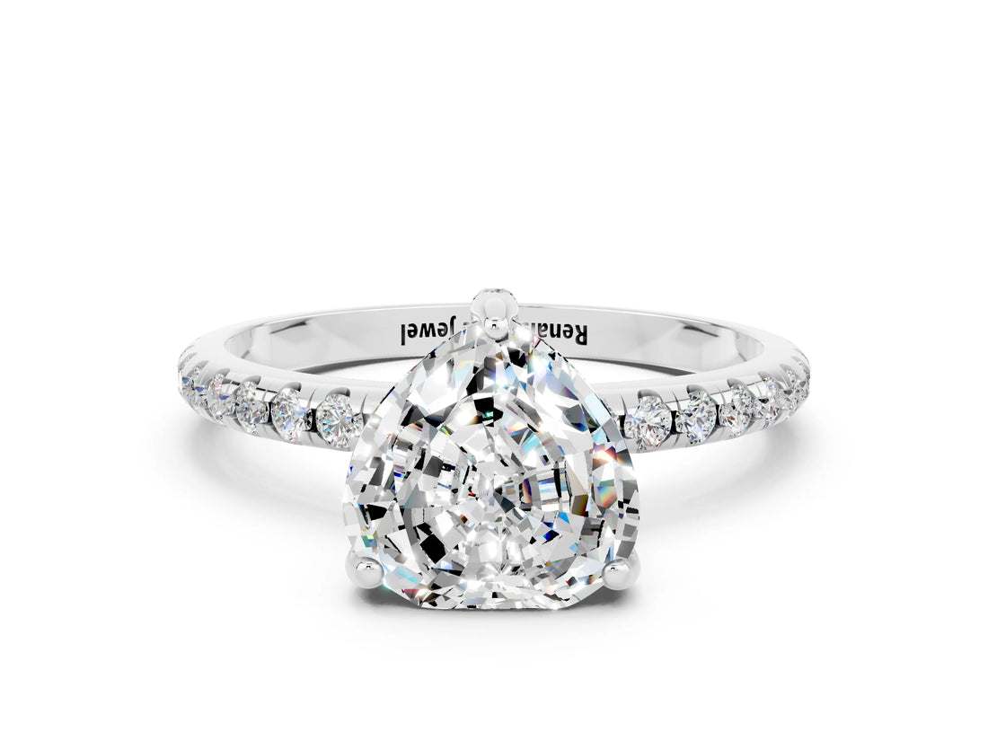 White gold Heart Cut Diamond Solitaire Ring with Four-Prong Setting and Pavé Band