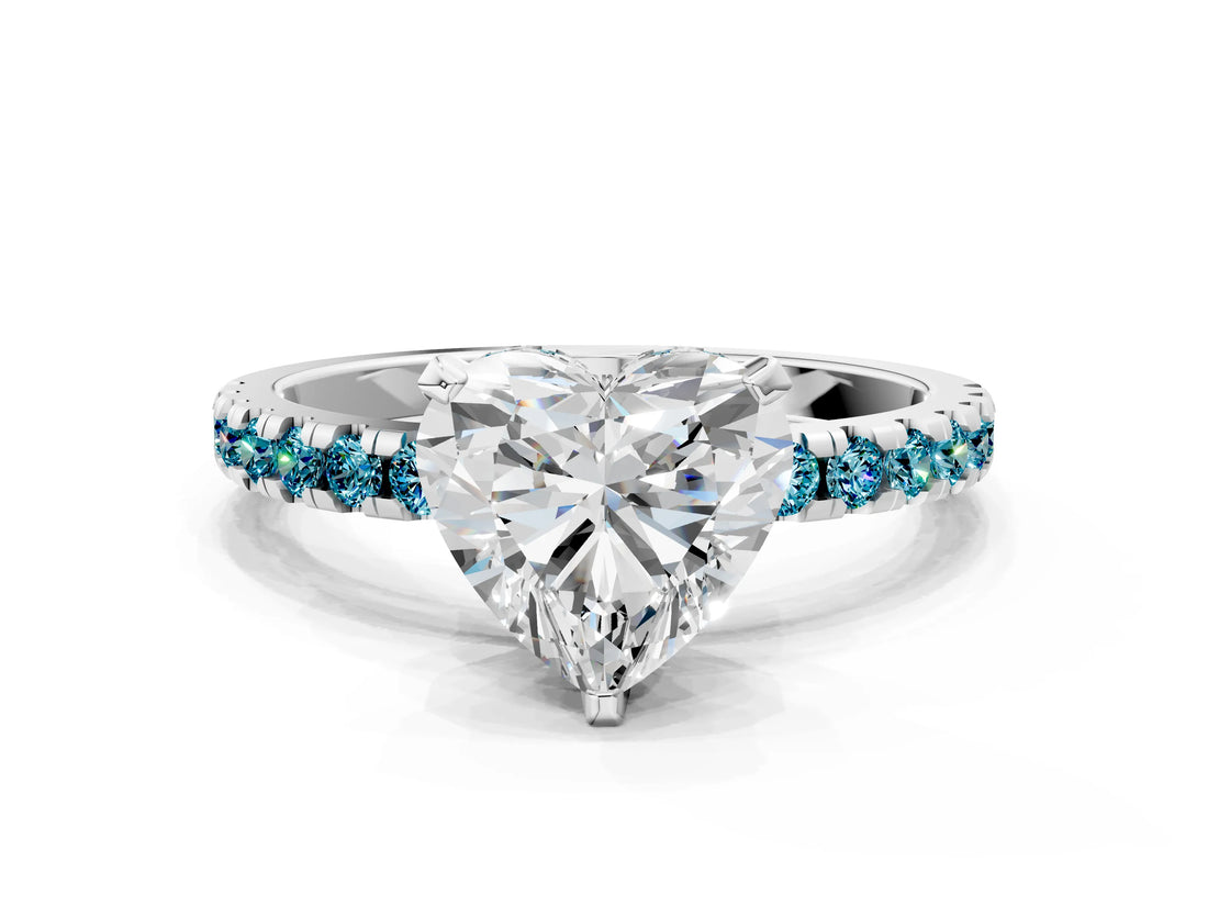 White gold Heart Cut Diamond Solitaire Ring with Round with Blue Topaz side stone Pavé Band and Four-Prong Setting