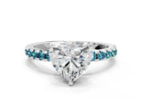White gold Heart Cut Diamond Solitaire Ring with Round with Blue Topaz side stone Pavé Band and Four-Prong Setting