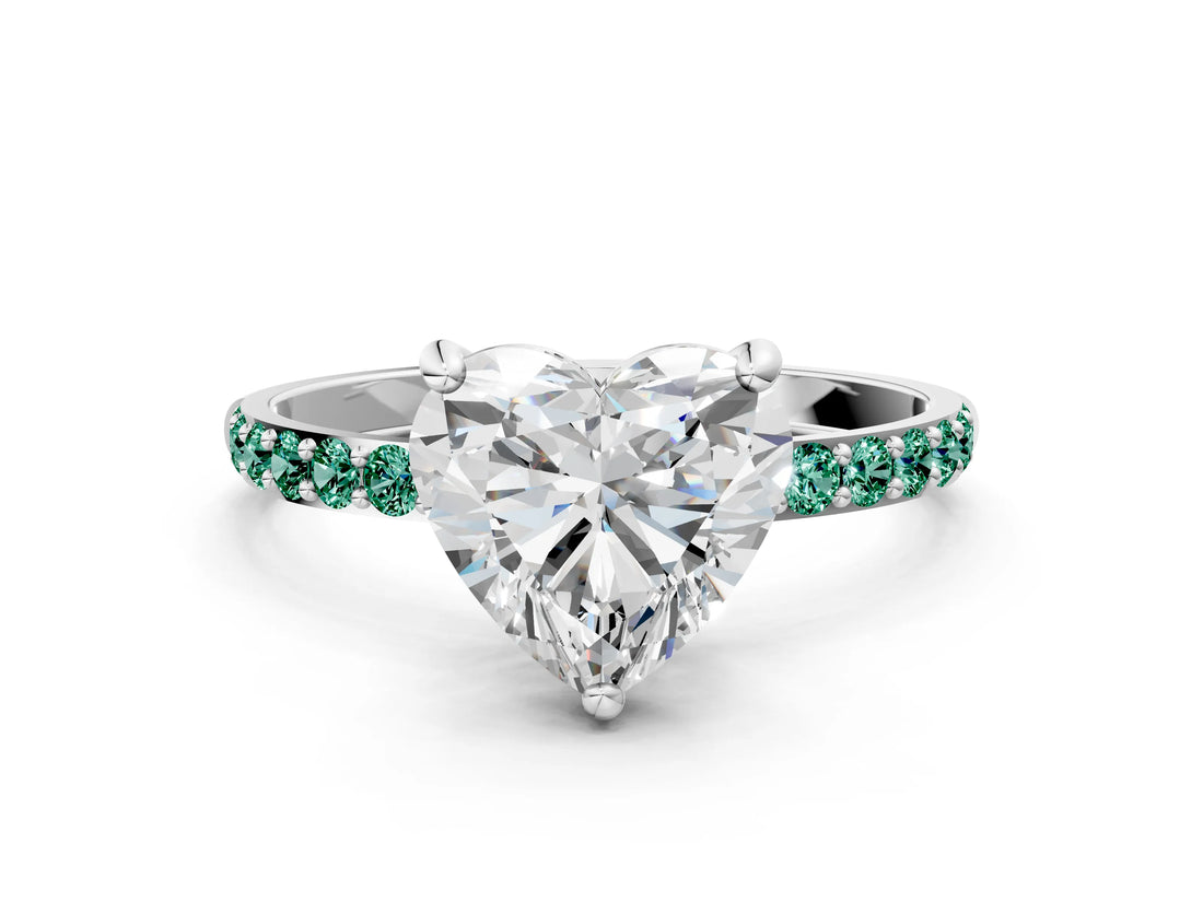 White gold Heart Cut Diamond Solitaire Ring with Round with Green Sapphire side stone Pavé Band and Prong Setting