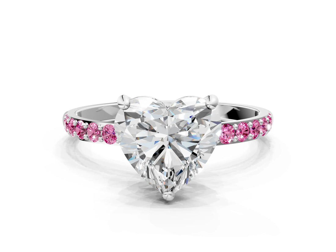 White gold Heart Cut Diamond Solitaire Ring with Round with Pink Sapphire side stone Pavé Band and Prong Setting
