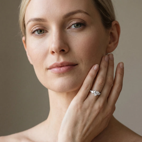 White gold Heart Cut Diamond Three-Stone Ring with Round Side Stones and Pavé Band
