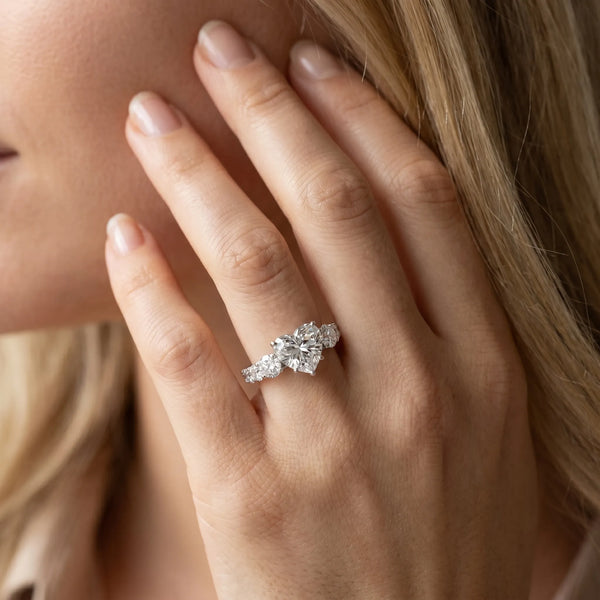 White gold Heart Cut Diamond Three-Stone Ring with Round Side Stones and Pavé Band