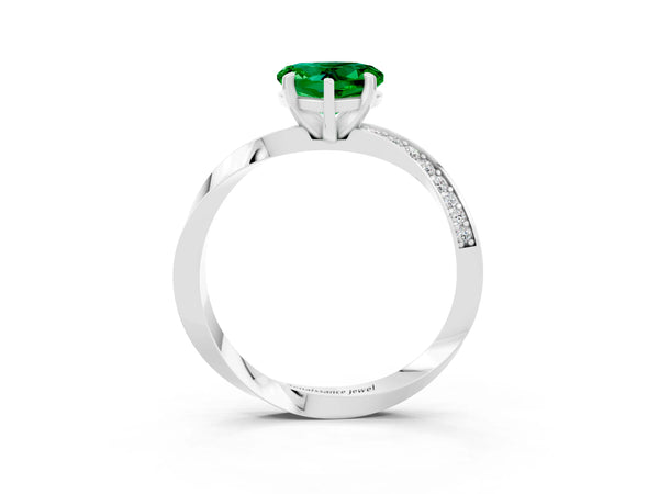 Silver Heart Cut Emerald Engagement Ring with Side Stone Accents and Four-Prong Setting