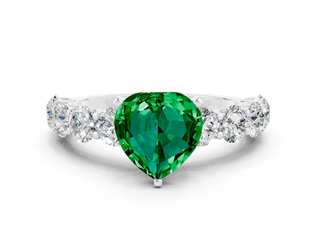 White gold Heart Cut Emerald Prong Setting with Side Stones on a Pave Band