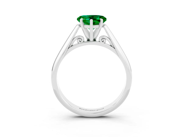 Platinum Heart Cut Emerald Solitaire Engagement Ring with Cathedral Setting and Four-Prong Mount