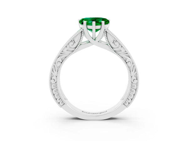 Silver Heart Cut Emerald Solitaire Ring with Engraved Band and Four-Prong Setting