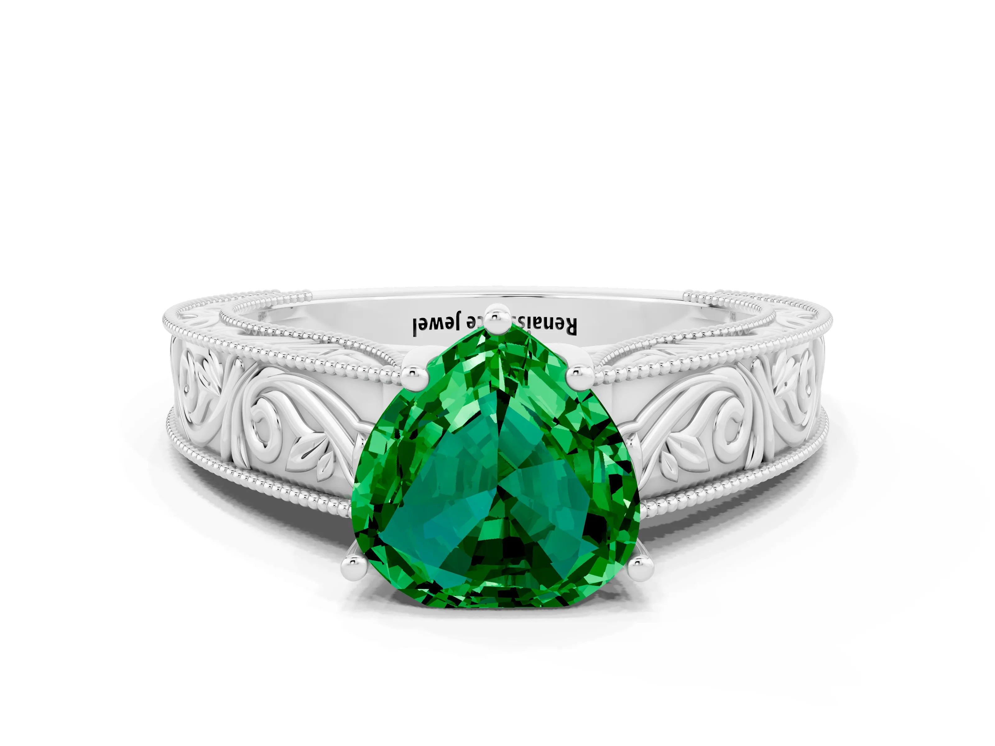 White gold Heart Cut Emerald Solitaire Ring with Engraved Band and Four-Prong Setting