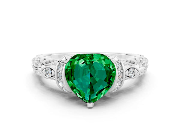 Platinum Heart Cut Emerald Solitaire Ring with Filigree Band and Four-Prong Setting
