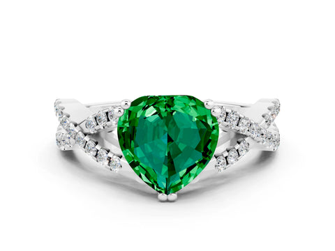 White gold Heart Cut Emerald Solitaire Ring with Four-Prong Setting and Twisted Pavé Band