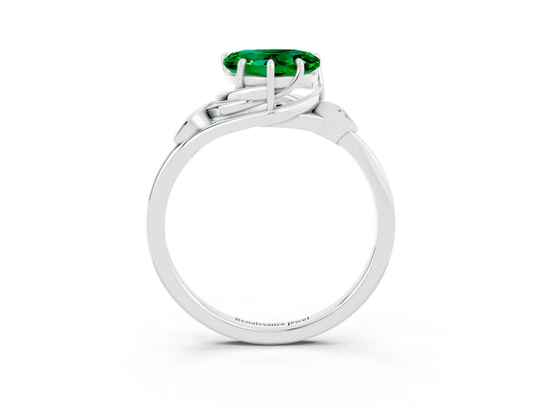 Platinum Heart Cut Emerald Solitaire Ring with Twist Band and Four-Prong Setting