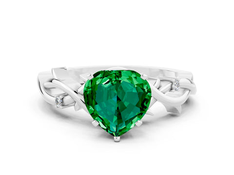 White gold Heart Cut Emerald Solitaire Ring with Twisted Band and Prong Setting