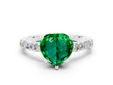 White gold Heart Cut Emerald Solitaire with Side Baguettes and Channel Set Band