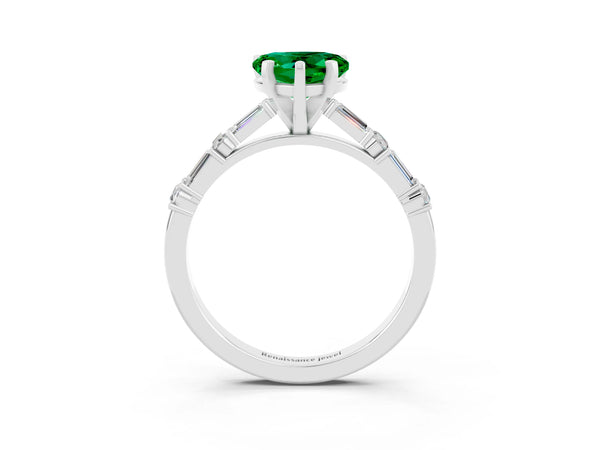 White gold Heart Cut Emerald Solitaire with Side Baguettes and Channel Set Band