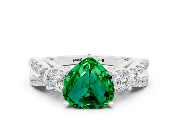 White gold Heart Cut Emerald Three-Stone Ring with Pavé Split Shank and Four-Prong Setting