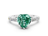 White gold Heart Cut Green Sapphire Solitaire with Side Baguettes and Channel Set Band