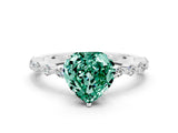 White gold Heart Cut Green Sapphire Solitaire with Side Stones on a Pavé Band and Four-Prong Setting