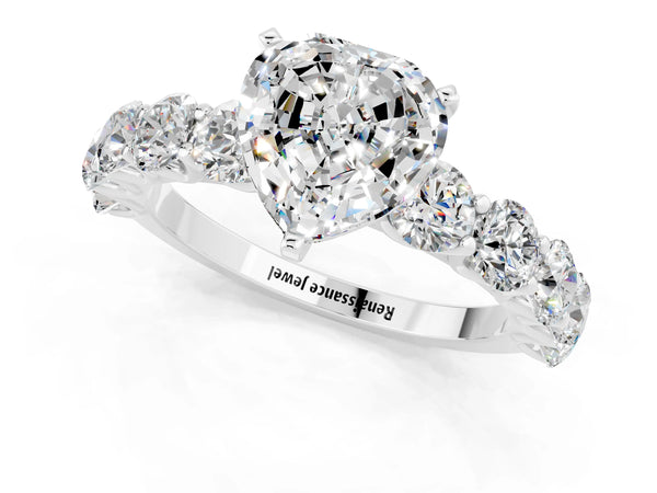 Platinum Heart Cut Moissanite Prong Setting with Side Stones on a Pave Band