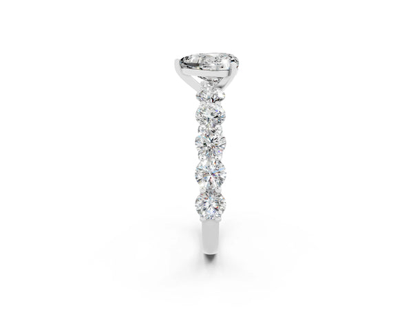 White gold Heart Cut Moissanite Prong Setting with Side Stones on a Pave Band